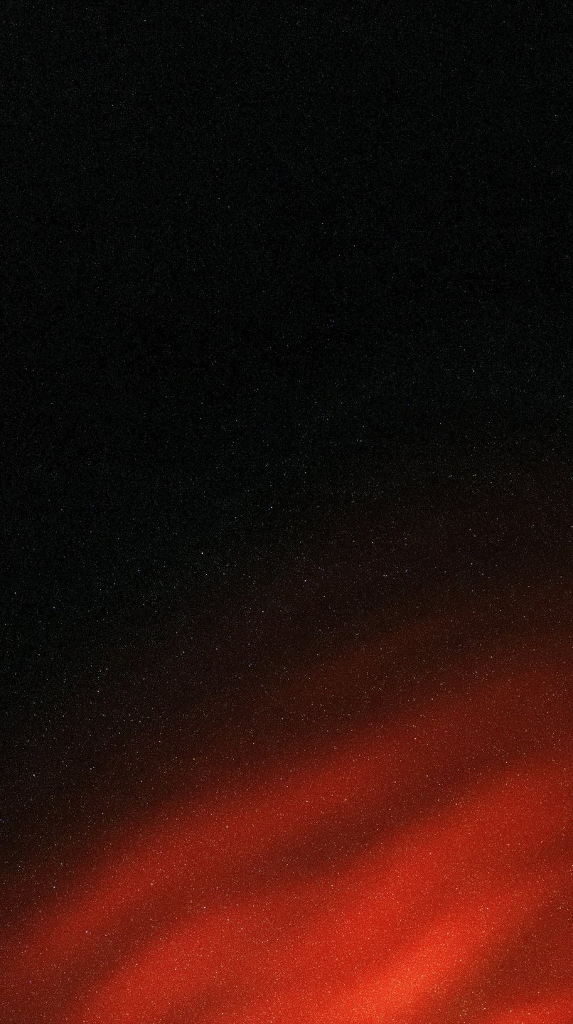 Abstract red light leak and cinematic film grain texture glowing diagonally across a dark black background.