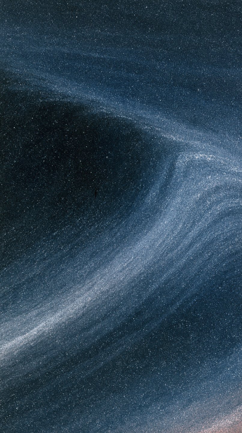 Swirling dark blue fluid texture filled with shimmering silver glitter particles resembling a cosmic nebula.