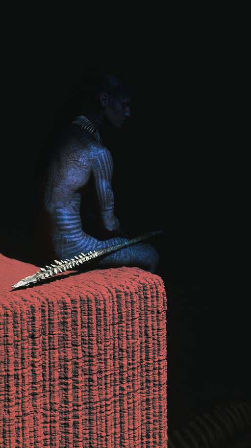 Blue-skinned tribal warrior sitting in profile on a textured red block holding a bone spear.