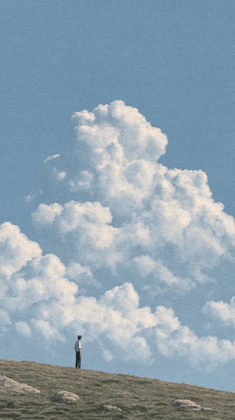 A solitary figure stands on a grassy hill under a massive, towering white cloud in a blue sky.