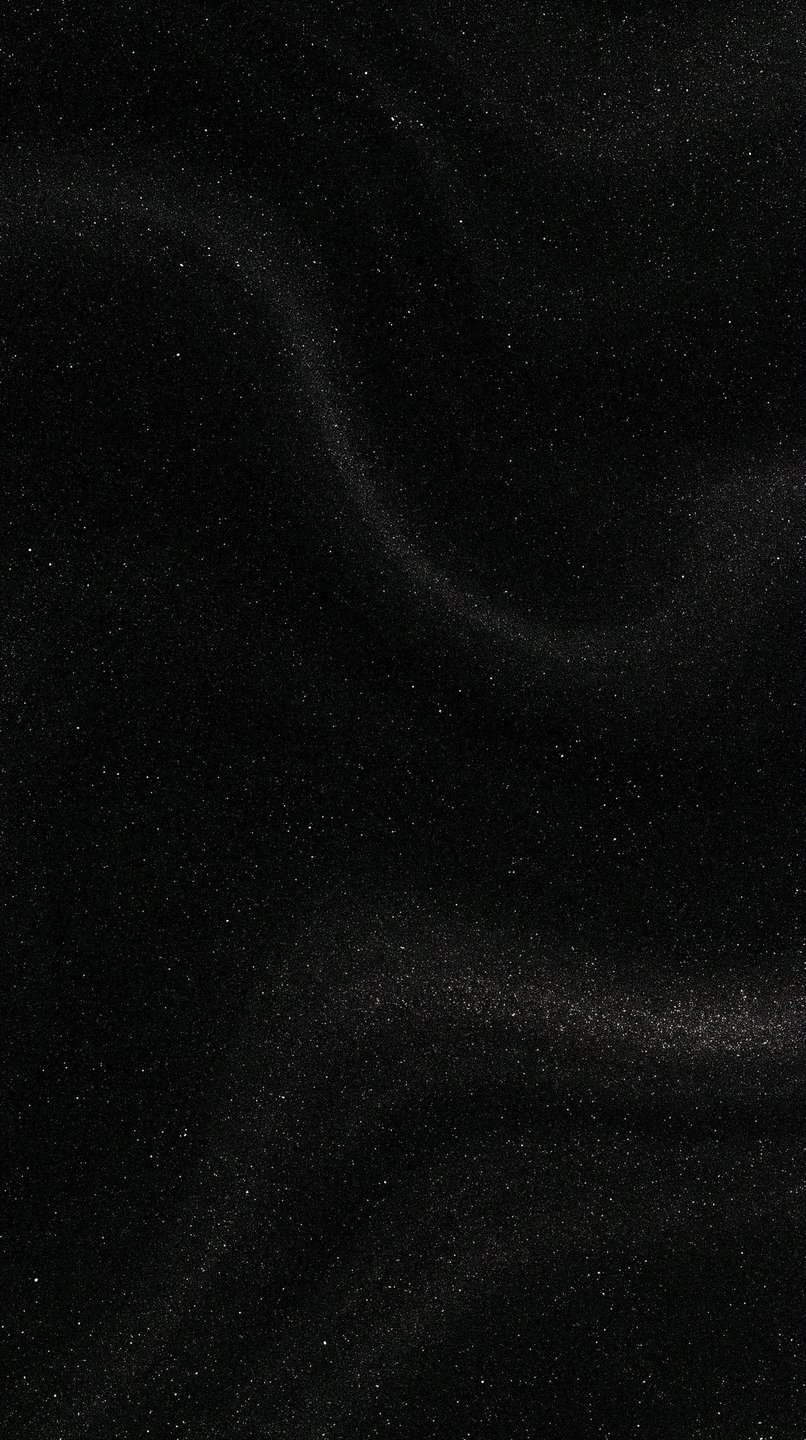 Monochromatic starfield with fine white cosmic dust sweeping elegantly across a deep black background.