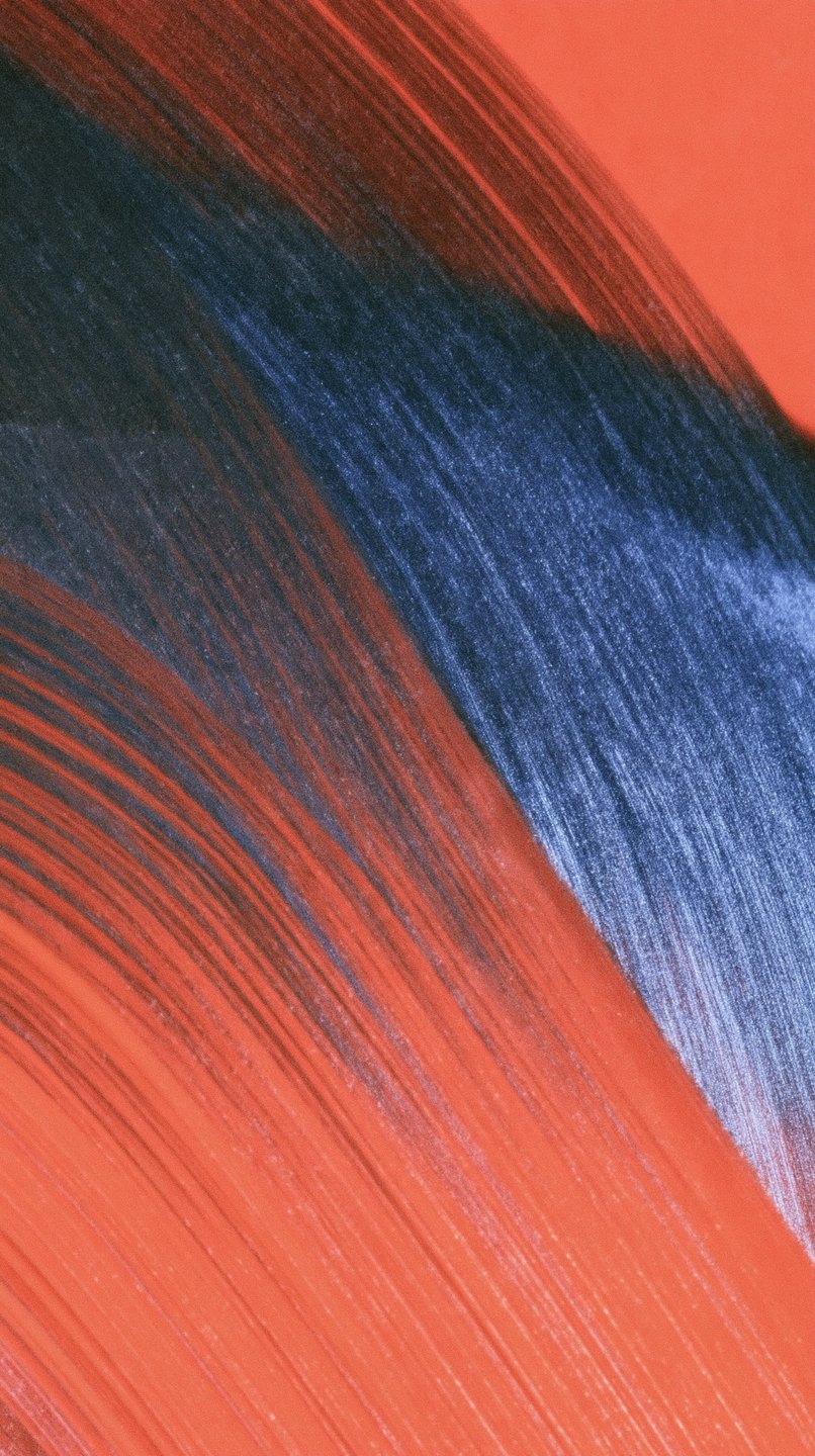 Dynamic diagonal brushstrokes of terracotta orange and deep indigo blue paint showcasing rich bristle textures and impasto ridges.