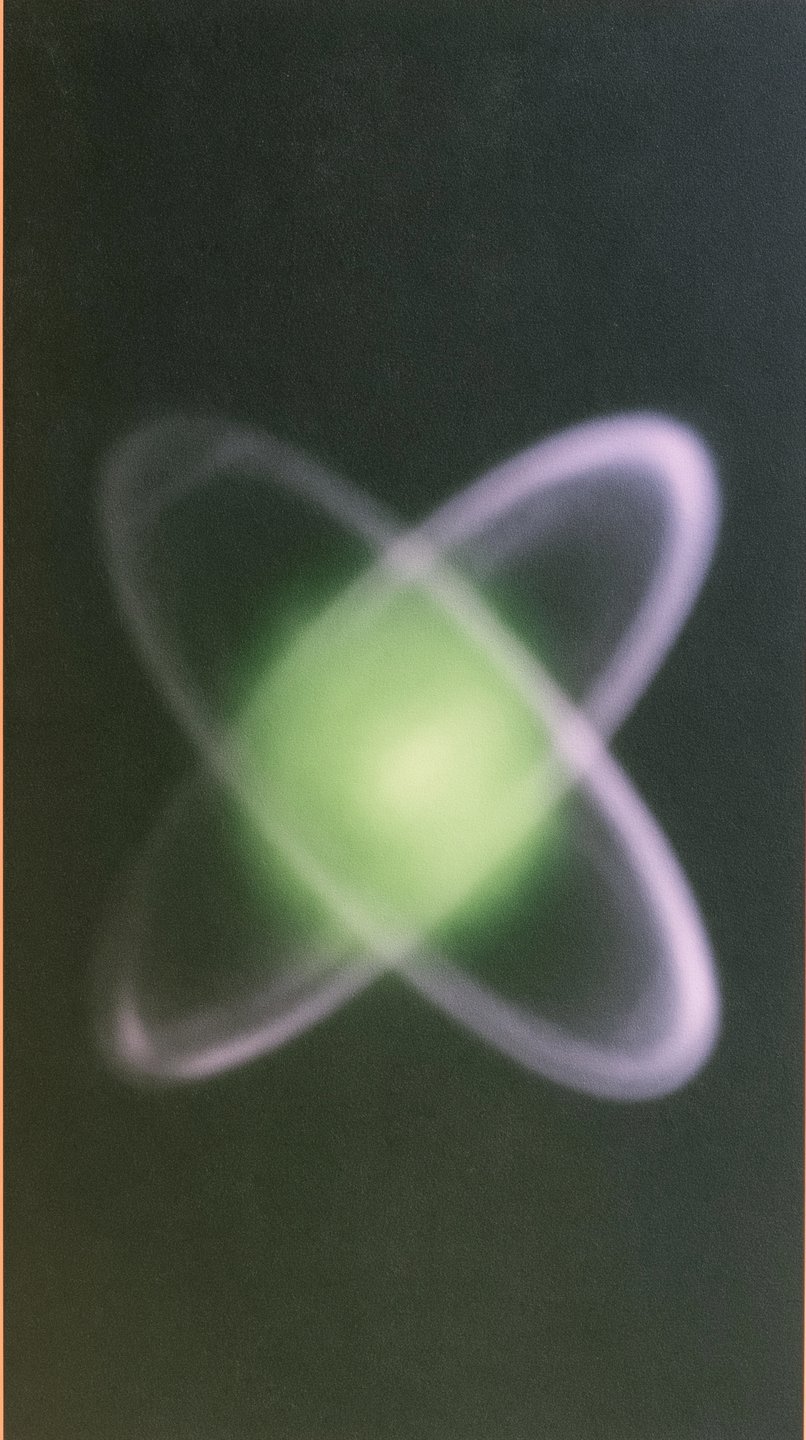 Glowing green central core surrounded by two intersecting soft-focus purple rings on a dark textured background.