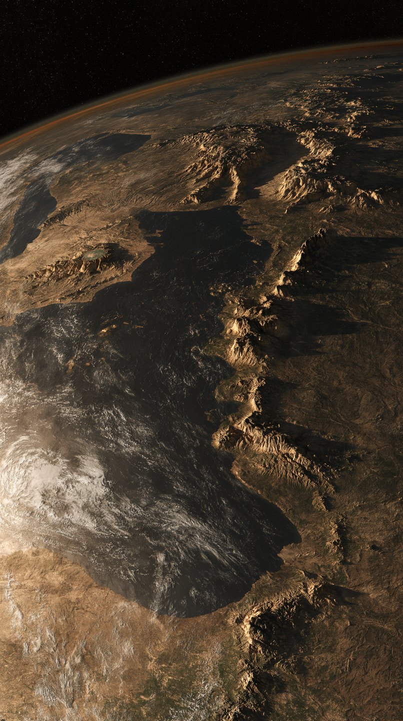 High-altitude orbital view of a rugged planet surface with massive mountain ranges and a glowing atmosphere.