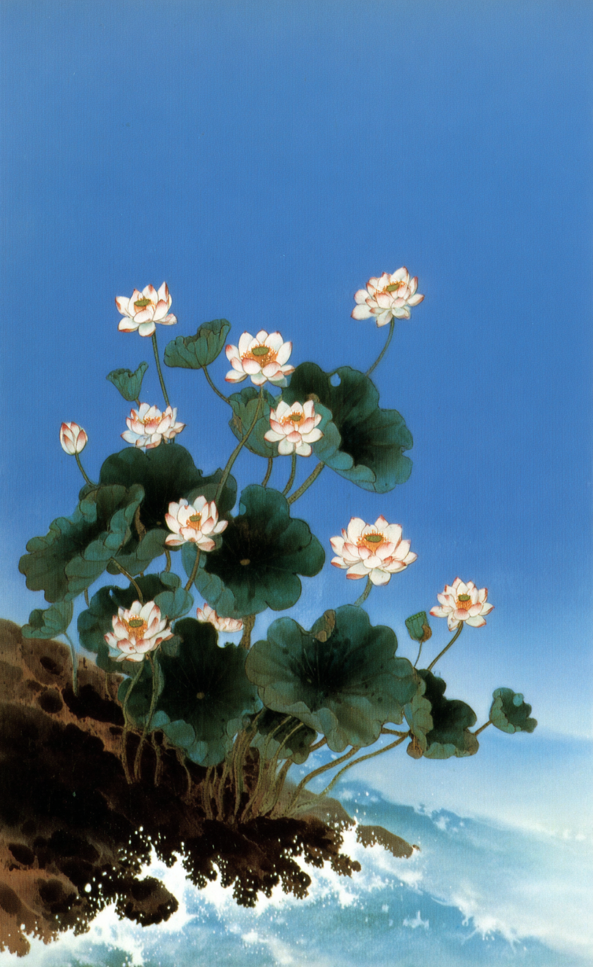 White lotus flowers bloom on a dark rocky cliff above crashing blue waves under a clear sky.