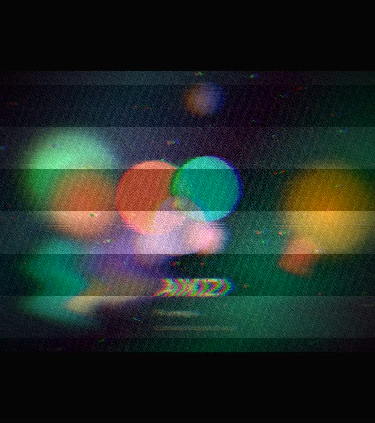 Coloured circles and the word AIKIZI with red and blue fringes, speckle and a bent band, like worn video tape