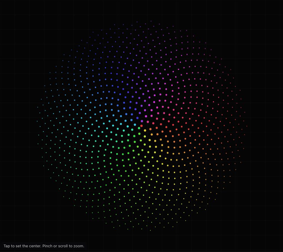 A round seed head of a thousand rainbow dots, larger in the middle, with spiral arms turning both ways