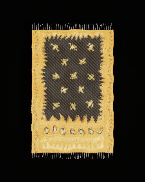 A temple motif: a stepped border around a dotted field
